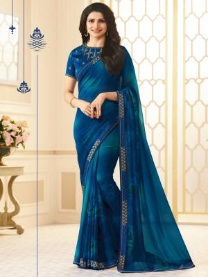 Add This Pretty Saree To Your Wardrobe In Dark Blue Color Paired With Dark Blue Colored Blouse. This Saree Is Fabricated On Georgette paired With Art Silk Fabricated Blouse. It Is Beautified With Embroidered Lace Border And Blouse. Buy Now.
