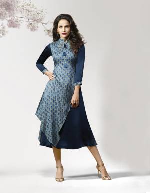 Kurtis Always Gives A Trendy And Pretty Look, Grab This Lovely Readymade Kurti In Blue Color Fabricated On Crepe Silk Beautified With Prints and Patch Work. It IS Soft Towards Skin And Easy To Carry All Day Long.
