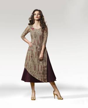 Here Is A Kurti For Your Semi-Casual Wear In Beige And Wine Color Fabricated Crepe Silk. It Is Beautified With Prints And Patch Work. Buy This Readymade Designer Kurti Now.