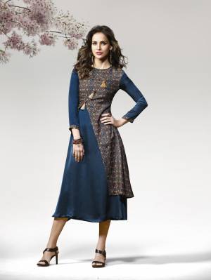 Kurtis Always Gives A Trendy And Pretty Look, Grab This Lovely Readymade Kurti In Blue Color Fabricated On Crepe Silk Beautified With Prints and Patch Work. It IS Soft Towards Skin And Easy To Carry All Day Long.