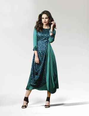 Add This Lovely Shade Of Green To Your Wardrobe With This Readymade Kurti In Teal Green Color Fabricated On Crepe Silk. It Is Beautified With Prints And Patch Work With An Elegant Drape Pattern. It Is Light Weight And Easy To Carry All Day Long. Buy Now.