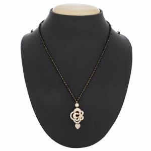 Elegant Looking Mangalsutra Is Here In Golden Colored Pendant Beautified with White Colored Stones And Pearl. It Is Light Weight And Easy To Carry All Day Long.