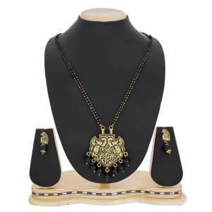 Here Is A Beautiful, Traditonal And Heavy Looking Magalsutra Is Here Paired With Matching Earrings. This Magalsutra Is For Occasion Wear That Can Be Paired With Any Traditional Attire. Buy Now.