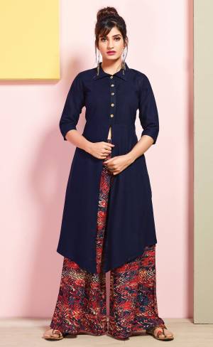 For An Elegant And Beautiful Look, Grab This Readymade Set Of Kurti And Plazzo. This Kurti Is In Navy Blue Color Paired With Multi Colored Bottom. It Is Fabricated On Rayon Cotton Beautified with Prints. Buy This Set Now.