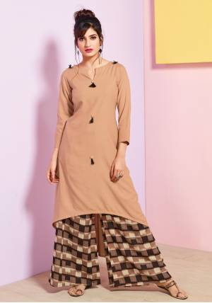 Flaunt Your Rich And Elegant Taste Wearing This Readymade Set Of Kurti And Plazzo In Beige Colored Kurti Paired With Brown Colored plazzo. Both Top And Bottom Are fabricated On Rayon Cotton Beautified With Prints. Buy This Pretty Set Now.