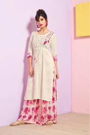 Adorn The Pretty Angelic Look Wearing This Readymde Kurti In White Color Paired With Pink Colored Plazzo. This Kurti And Plazzo Are Fabricated On Rayon Cotton Beautified With Prints. Its Fabrics Are Soft Towards Skin And Easy To Carry All Day Long.