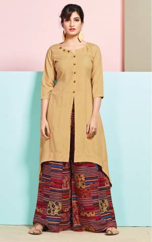 Flaunt Your Rich And Elegant Taste Wearing This Readymade Set Of Kurti And Plazzo In Beige Colored Kurti Paired With Red Colored plazzo. Both Top And Bottom Are fabricated On Rayon Cotton Beautified With Prints. Buy This Pretty Set Now.