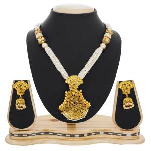 Here Is A Beautiful Queen Necklace Set In Golden And White Color Beautified with Stone and Moti Work. This Necklace Set Can Be Paired With Silk Saree Or Straigth Suit For A Beautiful Look. Buy Now.