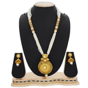 Here Is A Beautiful Queen Necklace Set In Golden And White Color Beautified with Stone and Moti Work. This Necklace Set Can Be Paired With Silk Saree Or Straigth Suit For A Beautiful Look. Buy Now.