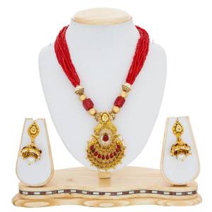Red And Gold Are The Two Most Attractive Colors, Grab This Beautiful Necklace Set In Red And Golden Beautified With Moti And Stone Work. Buy Now.