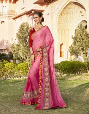 Look Beautiful Wearing This Saree In Pink Color Paired With Red Colored Blouse. This Saree Is Fabricated On Silk Chiffon Paired With Art Silk Fabricated Blouse. It Is Beautified With Embroidered Lace Border And Motifs. Buy now.