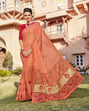 Most Demanding And Running Color Of The Season Is Here With This Designer Saree In Peach Color Paired With Contrasting Dark Pink Colored Blouse. This Saree Is Fabricated On Chiffon Paired With Art Silk Fabricated Blouse. Buy This Designer Saree Now.