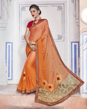 Shades Are In This Season So Grab This Saree In Peach And Yellow Color Paired With Contrasting Red Colored Blouse. This Saree Is Fabricated On Chiffon Paired With Art Silk Fabricated Blouse. It Has Bold Floral Embroidery Over The Saree.