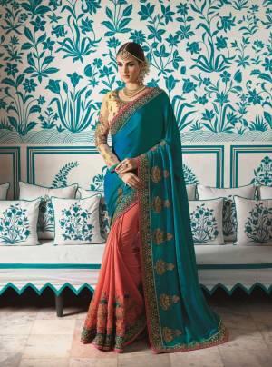 Grab This Lovely Combination In Blue And Peach Colored Saree Paired With Beige Colored Blouse. This Saree Is Fabricated On Satin Silk Paired With Silk Tissue Fabricated Blouse. It Has Heavy Embroidery Over the Saree Lace Border And Blouse. Buy This Designer Saree Now.