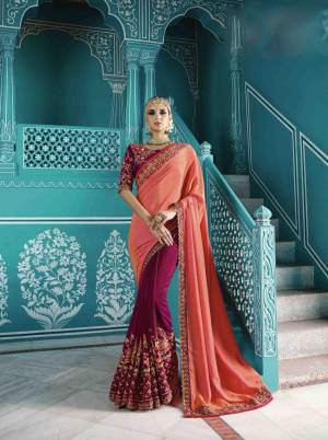 Look Beautiful Wearing This Designer Saree In Peach And Wine Color Paired With Wine Colored Blouse. This Saree Is Fabricated On Satin Silk Paired With Art Silk Fabricated Blouse. It Is Beautified With Attractive Floral Embroidery Over The Saree And Blouse.