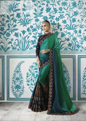 Shades Are In This Season, So grab this Shaded Saree In Green And Blue Color Paired With Navy Blue Colored Blouse. This Saree Is Fabricated On Satin Silk Paired With Velvet Fabricated Blouse. It Has Heavy Embroidery Over The Blouse And Saree. Buy It Now.
