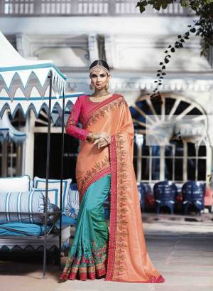 Colors Plays A Very Important Role In Making Any Outfit Attractive. So Grab This Colorful Saree In Peach And Blue Color Paired With Pink Colored Blouse. This Saree Is Fabricated On Satin Silk Paired With Art Silk Fabricated Blouse. It Has Lovely Attractive Embroidery all Over It. Buy Now.