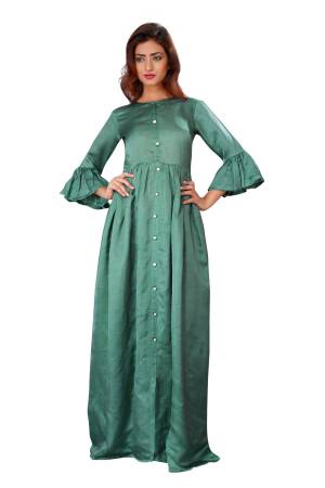 Add This Lovely Shade Of Green To Your Wardrobe With This Readymade Gown In Fern Green Color Fabricated On Linen Silk. It Has Beautiful Sleeve Pattern. Buy Now.