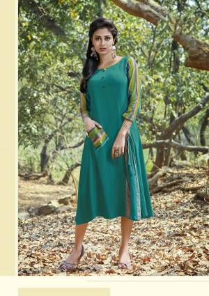 Add This New Shade Of Green To Your Wardrobe With This Teal Green Colored Readymade Kurti Fabricated On Rayon Cotton. This Kurti Is Light In Weight And Soft Towards Skin. Buy Now.