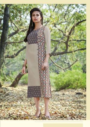 Be It Your College, Office Or Home, This Kurti Is Suitable For All. Grab This Pretty Grey Colored Readymade Kurti Fabricated On Rayon Cotton Beautified With Prints. Buy Now.