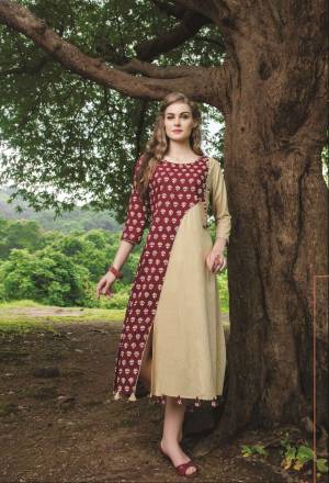 Beautiful Front Slit Patterned Readymade Kurti Is Here In Maroon And Beige Color Fabricated On Cotton Beautified With Prints. This Readymade Kurti Is Available In Many Sizes. Buy This Pretty Kurti Now.