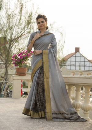 Flaunt Your Rich And Elegant Taste Wearing This Rich Colored Saree In Grey Color Paired With Grey Colored Blouse. This Saree And Blouse Are Fabricated On Cotton Art Silk Which Is Easy Drape And Will Give A Rich Look Like Never Before.