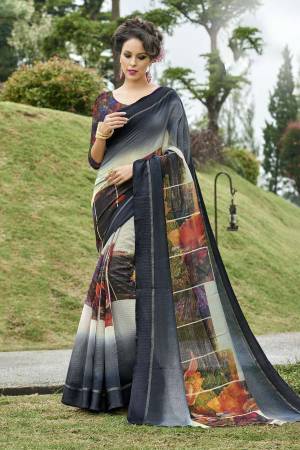 Flaunt Your Elegance Wearing This Saree In Dark Grey Color Paired With Multi Colored Blouse. This Saree And Blouse Are Fabricated On Chanderi Silk Beautified With Multi Colored Prints. 