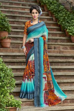 Attract All wearing This Saree In Bright Shade Of Blue Colored Saree Paired With Contrasting Orange Colored Blouse. This Saree And Blouse Are Fabricated On Chanderi Silk  Beautified With Prints All Over It. 