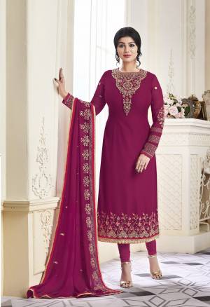 Attract All Wearing This Pretty Attractive Designer Straight Cut Suit In Magenta Pink colored Top Paired With Magenta Pink Colored Bottom And Dupatta. Its Top Is Fabricated On Georgette Paired With Santoon Bottom And Georgette Dupatta. It Has Heavy Embroidery Over The Top And Dupatta. Buy This Semi-Stitched Suit Now.
