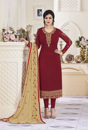 Adorn The Beautiful Queen Look Wearing This Designer Straight Cut Suit In Maroon Colored Top Paired With Maroon Colored Bottom And Beige Colored Dupatta. Its Top Is Fabricated On Georgette Paired With Santoon Bottom And Georgette Dupatta. It Is Light Weight And Easy To Carry All Day Long. 
