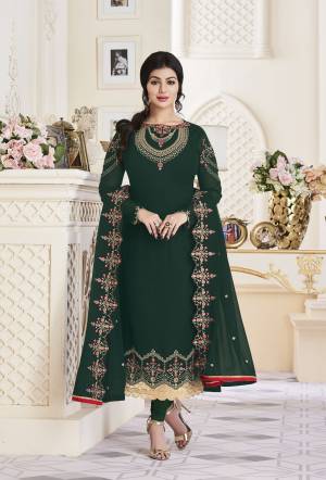 You Will Definitely Earn Lots Of Compliments Wearing This Designer Straight Cut Suit In Dark Green Color Paired With Dark Green Colored Bottom And Dupatta. Its Embroidered Top Is Fabricated On Georgette Paired with Santoon Bottom And Embroidered Georgette Dupatta. Its Lovely Color And Embroidery Will Give An Attractive Look To Your Personality Like Never Before.