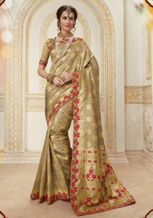 Flaunt Your Rich And Elegant Taste Wearing This Saree In Beige Color Paired With Beige Colored Blouse. This Saree And Blouse Are Fabricated On Jacquard Silk Beautified With Weave And Heavy Embroidery Over The Lace Border. Buy Now.