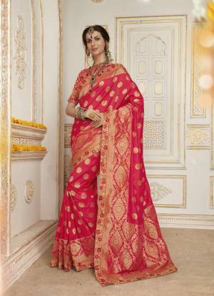 Shine Bright Wearing This Attractive Pink Colored Saree Paired With Pink Colored Blouse. This Saree And Blouse Are Fabricated On Jacquard Silk Beautified With Weaving And Embroidered Lace Border. This Saree Will Give A Rich Look Like Never Before.
