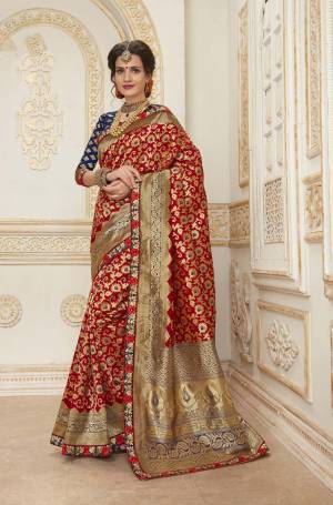 Bright And Visually Appealing Color Is Here With This Saree In Red Color Paired With Contrasting Navy Blue Colored Blouse. This Saree And Blouse Are Fabricated On Jacquard Silk Beautified With Weave And Embroidered Lace Border. Buy This Saree Now.