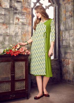 Look Pretty In This Different Patterned Readymade Kurti In Green And White Color Fabricated On Cotton Beautified With Prints. Pair This Up With Green Colored Leggings. Buy Now.
