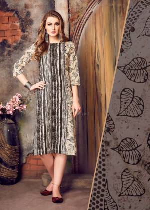 Simple And Elegant Looking Kurti Is Here With This Kurti In Cream And Black Color Fabricated On Cotton Beautified with Prints. This Kurti Is Suitable For Your Casual Or Semi-Casual Wear Pairing It Up With Black Colored Leggings.