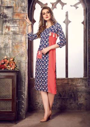For Your Casual Or Semi-Casual Wear, Grab This Readymade Kurti In Blue And Peach Color Fabricated On Cotton Beautified With Prints All Over It. It Ensures Superb Comfort All Day Long. Buy Now.
