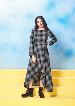 Here Is A High Low Patterned Deisgner Readymade Kurti In Dark Grey Color Fabricated On Cotton Beautified With Checks Prints all Over It. This Kurti Is Available In Many Sizes And Also Ensures Superb Comfort All Day Long.