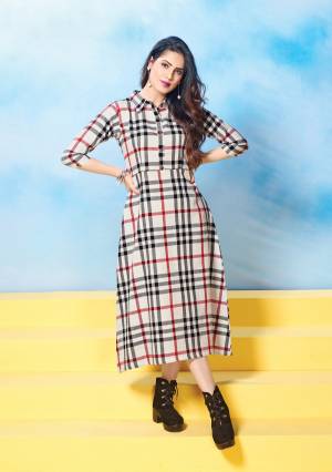 Flaunt Your Rich And Elegant Taste Wearing This Readymade Kurti In Off-White Color Fabricated On Cotton Beautified With Plaids Prints All Over It. Its Color Combination Will Earn You Lots Of Compliments And Its Fabrics Ensures Superb Comfort All Day Long.