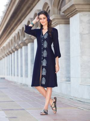 Adorn The Bold And Beautiful Personality Wearing This Readymade Kurti In Navy Blue Color Fabricated On Rayon Cotton. It Is Beautified With Thread Work. Buy Now.