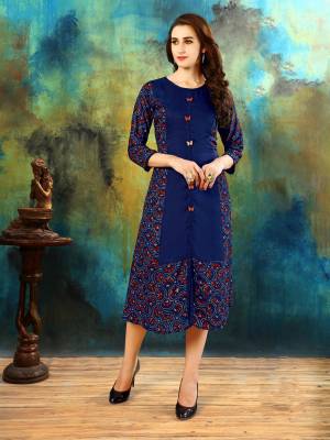 Grab This Pretty Blue Colored Readymade Kurti Fabricated On Rayin Cotton Beautified With Prints, Also It Is Soft Towards Skin And Easy To Carry All Day Long. Buy Now.