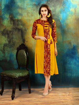 For Your Semi-Casual Wear, Grab This Pretty Readymade Kurti In Yellow Color Fabricated On Rayon Cotton Beautified With Prints. It Is Available In Many Sizes. Buy This Kurti Now.