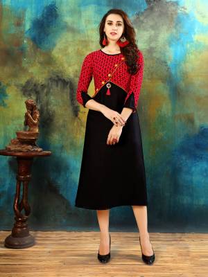 Enhance Your Beauty In This Lovely Patterned Readymade Kurti In Black And Red Color Fabricated On Rayon Cotton. This Kurti Is Ligt Weight And Easy To Carry All Day Long. Buy Now.