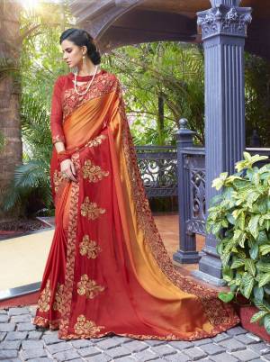 Orange And Red Color Induces Perfect Summery Appeal To Any Outfit, So Grab This saree In Orange And Red Color Paired With Red Colored Blouse. This Saree Is Fabricated On Satin Silk Paired With Art Silk Fabricated Blouse. It Has Heavy Embroidery Which Will Earn You Lots Of Compliments From Onlookers. 