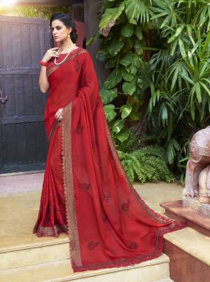 Adorn The Angelic Look Wearing This Saree In Red Color Paired With Red Colored Blouse. This Saree Is Fabricated On Chiffon Paired With Art Silk Fabricated Blouse. It Is Light Weight, Durable And Easy To Care For. Buy Now.