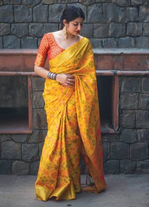 Celebrate This Festive With Grace And Elegance Wearing This Rich Looking Saree In Yellow Color Paired With Contrasting Red Colored Blouse. This Saree And Blouse Are Fabricated On Banarasi Art Silk Beautified With Weave All Over It. This Saree Is Light Weight And Easy To Carry All Day Long.