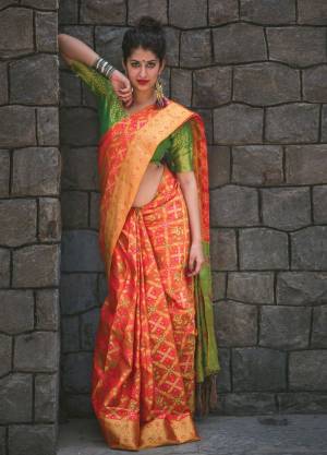 Get Ready For The Upcoming Festive Season With This Saree In Orange Color Paired With Contrasting Green Colored Blouse. This Saree And Blouse Are Fabricated On Banarasi Art Silk Beautified With Weave All Over It. It Is Easy To Drape Easy To Care For.