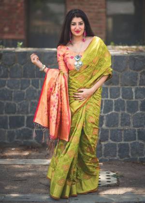 Earn Lots Of Compliments Wearing This Saree Pretty Saree In Pear Green Color Paired With Contrasting Peach Colored Blouse. This Saree And Blouse Are Fabricated On Banarasi Art Silk Which Gives A Rich Look To Your Personality.