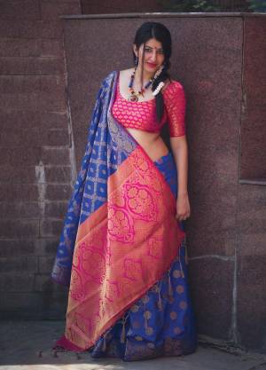 Attract All Wearing This Silk Saree In Blue Color Paired With Contrasting Dark Pink Colored Blouse. This Saree And Blouse Are Fabricated On Banarasi Art Silk Beautified With Weave All Over It. This Saree Is Light weight, easy to Drape And Carry All Day Long.