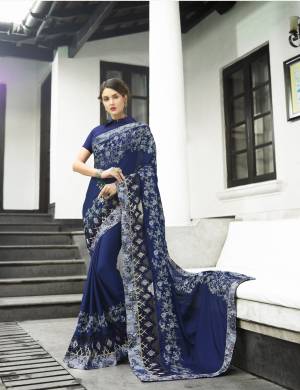 For A Bold And Beautiful Personality, Grab This Designer Saree In Navy Blue Color Paired With Navy Blue Colored Blouse. This Saree Is Fabricated On Georgette Paired With Art Silk Fabricated Blouse. It Is Beautified With Heavy Embroidery All Over It. Buy Now.
